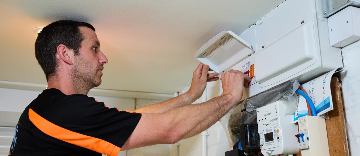 Hethersett Electrical engineer fitting a surge protection device into a consumer unit