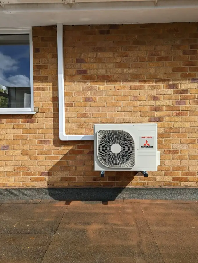 Air conditioning outdoor unit on a wall