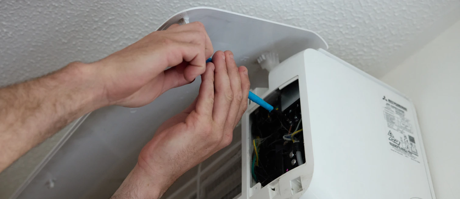 Hethersett Electrical engineer wiring a Mitsubishi air conditioning indoor unit in a garden room