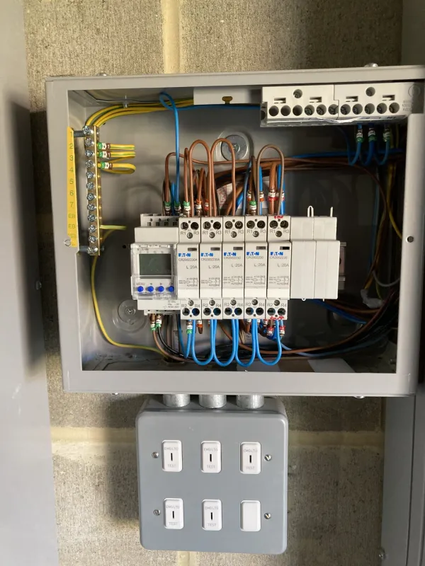 Lighting control panel with contactors and a time switch in a metal enclosure