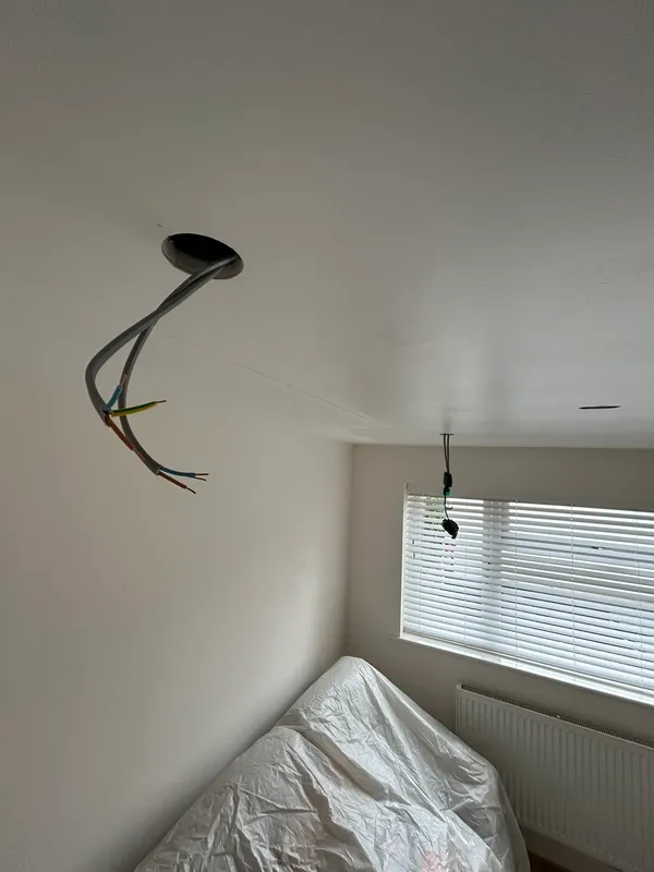 New lighting cable dropped through a ceiling rose during a rewire